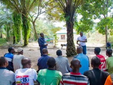 Jean Ayolo Yokolo and AWF Senior Social Safeguards Officer, Dodo Moke at one of their presentations to the scouts