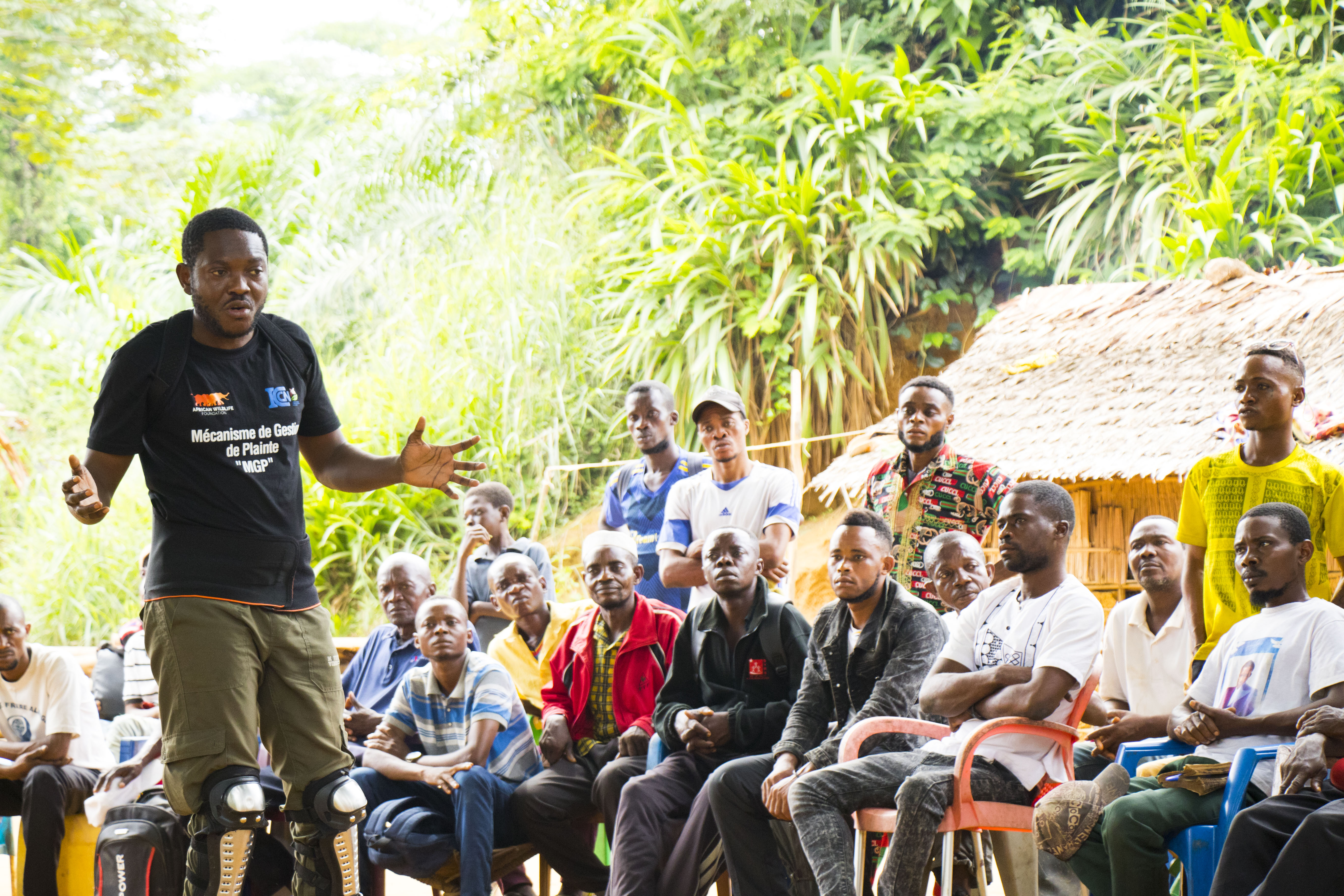 Dodo Moke presenting to community members in DRC