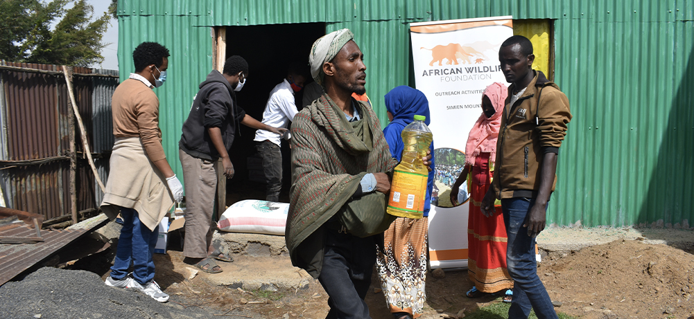 AWF distributing food rations and handwashing tools